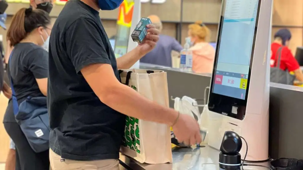 kiosk machines, self checkout kiosk at retail store
